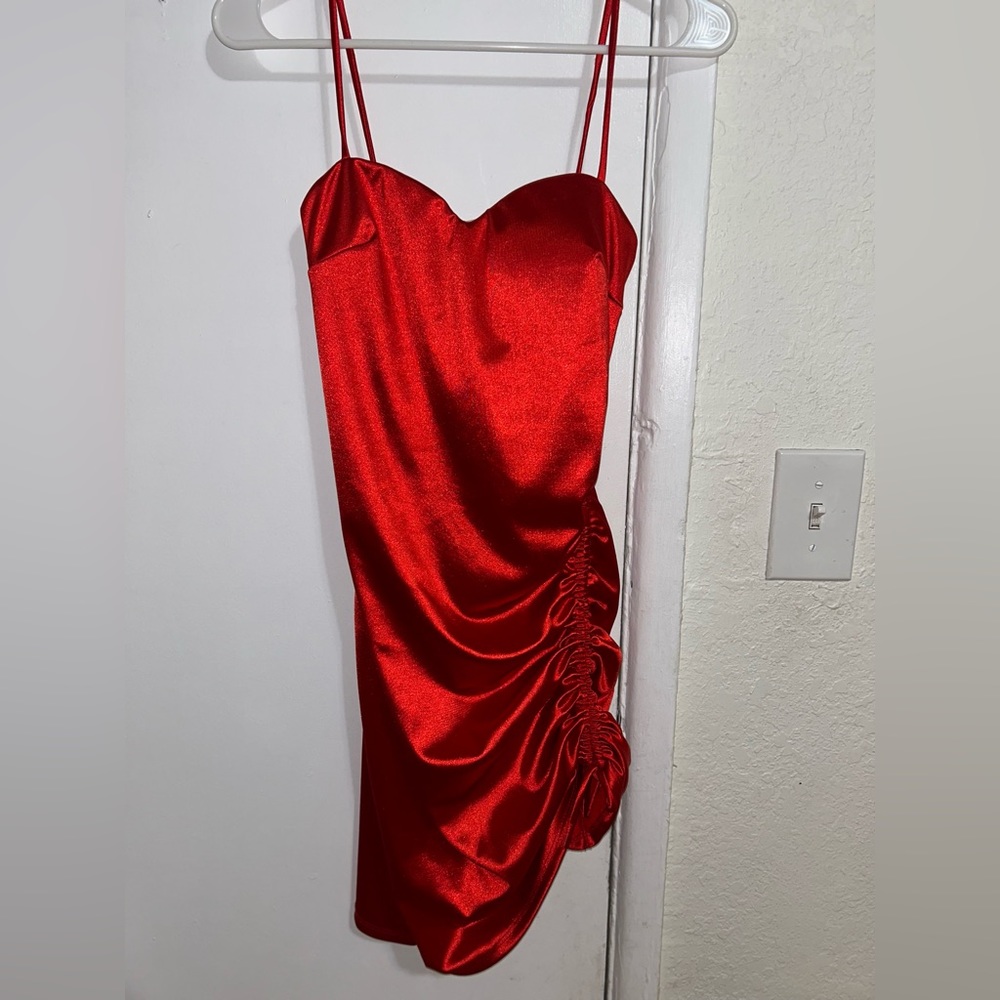 Red silk dress a lil mini with adjustable straps on the side of the leg